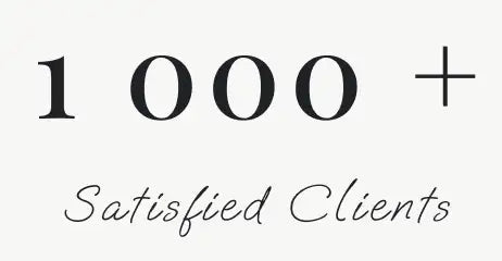 Black serif text reading ’1 000 +’ above cursive script saying ’satisfied clients’ on a light background.