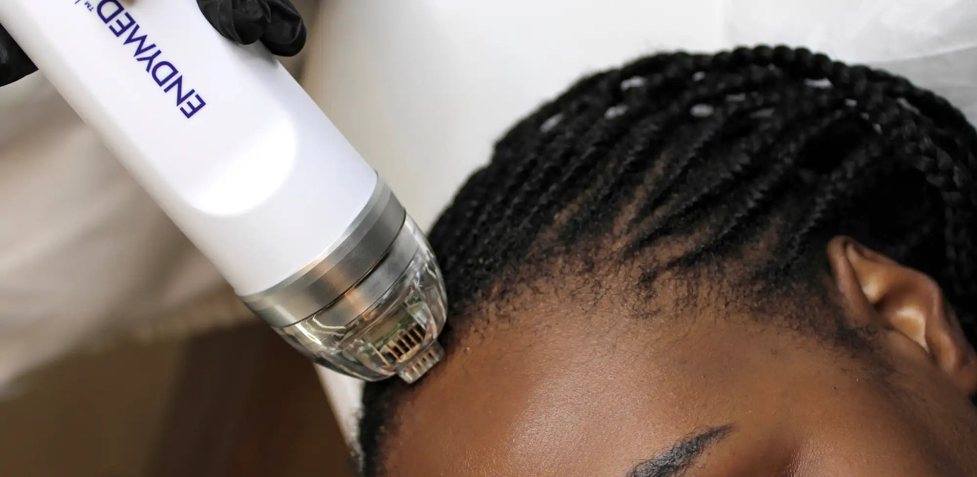 White and silver endymed hair restoration device with a clear treatment head