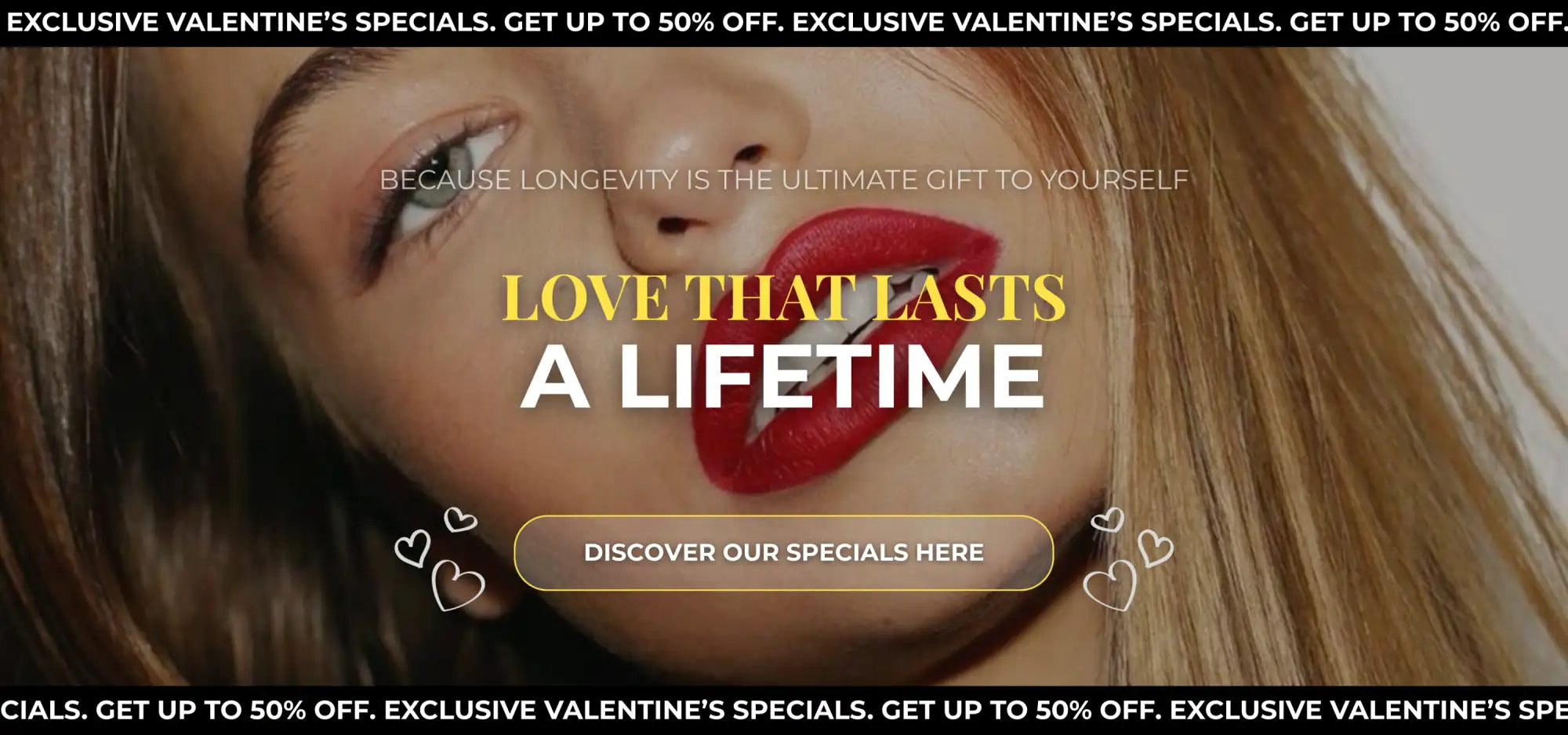 A woman with long blonde hair and bold red lipstick, her face partially framed by soft lighting.