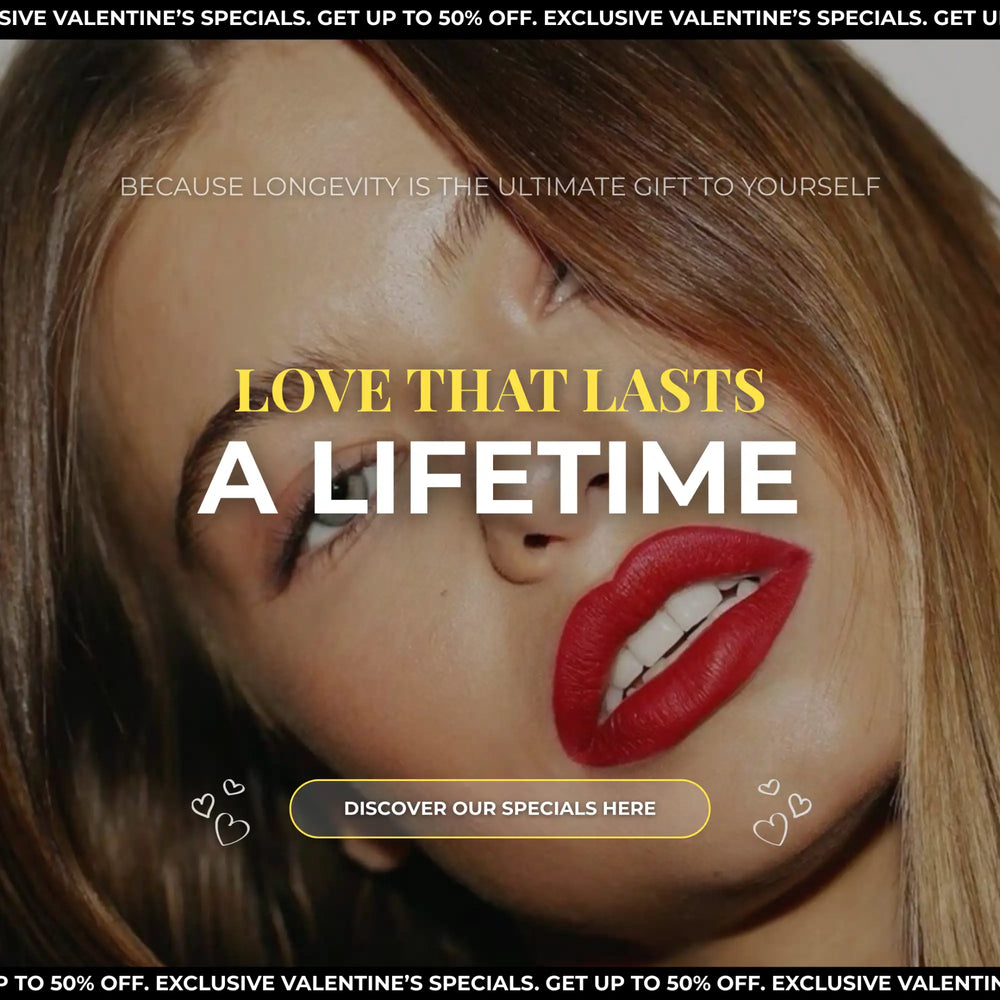 A woman with long brown hair and bold red lipstick smiles softly, her face framed by the text ’love that lasts a lifetime’ in a valentine’s day promotional ad.